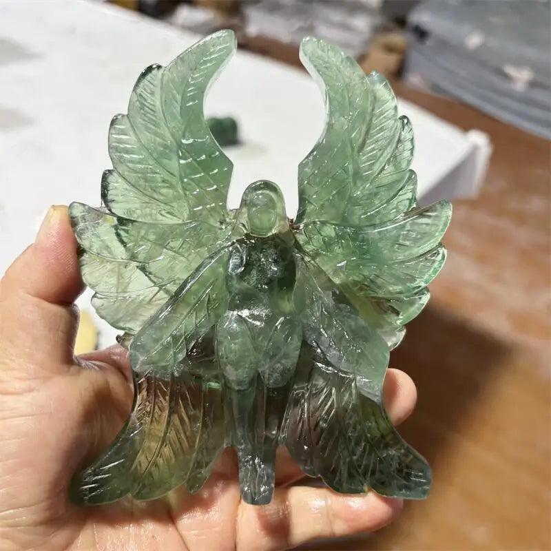 Hand-polished green fluorite Seraph angel figurine with luminous, forest-green wings for spiritual clarity and healing.