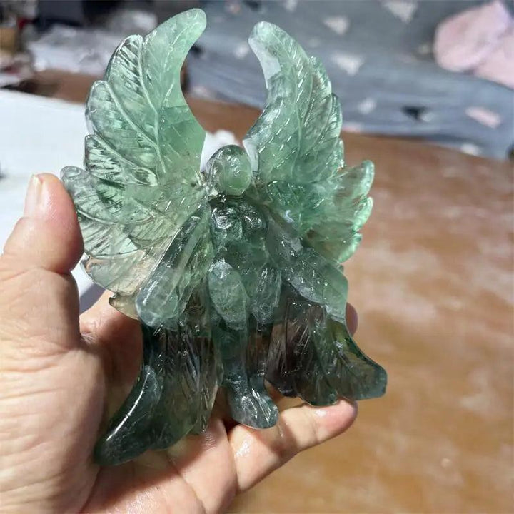 Hand-carved green fluorite Seraph angel figurine with luminous, forest-green wings for spiritual clarity and healing.