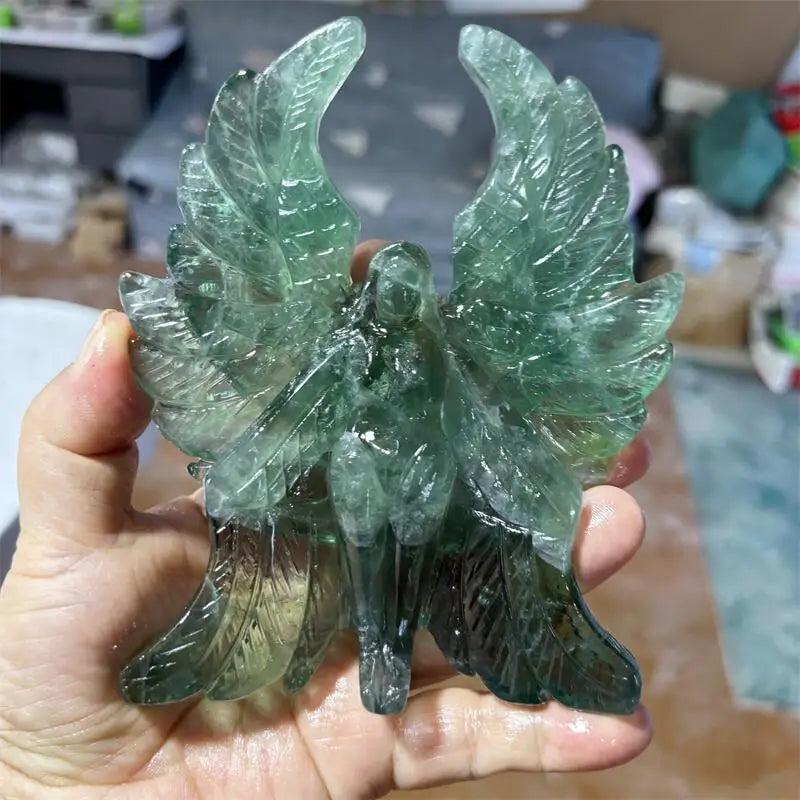 Hand-polished green fluorite Seraph angel figurine featuring intricate wings and luminous mint to forest green tones.