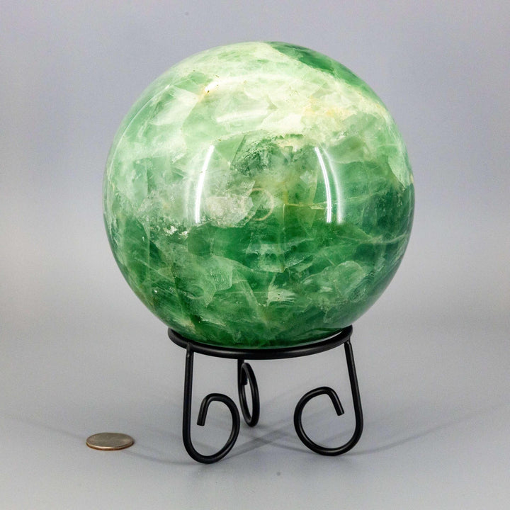 Collector-grade 153mm Green Fluorite Sphere crystal ball, displaying deep forest to pale celadon hues on a stand.