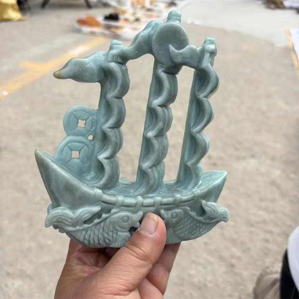 Hand-carved green jade sailboat statue for prosperity, featuring intricate details to manifest abundance and harmony.
