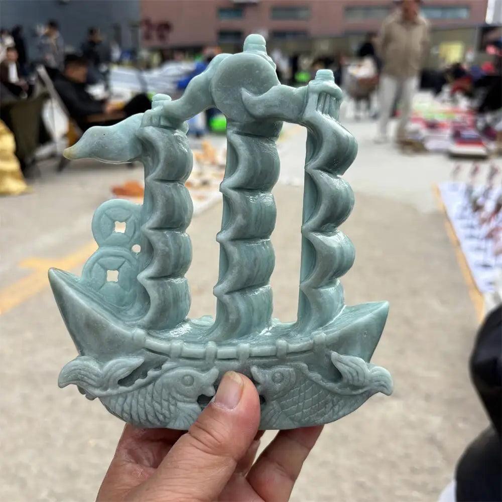 Hand-carved green jade sailboat statue, a symbol of abundance and prosperity for your desk or Heart Chakra healing.