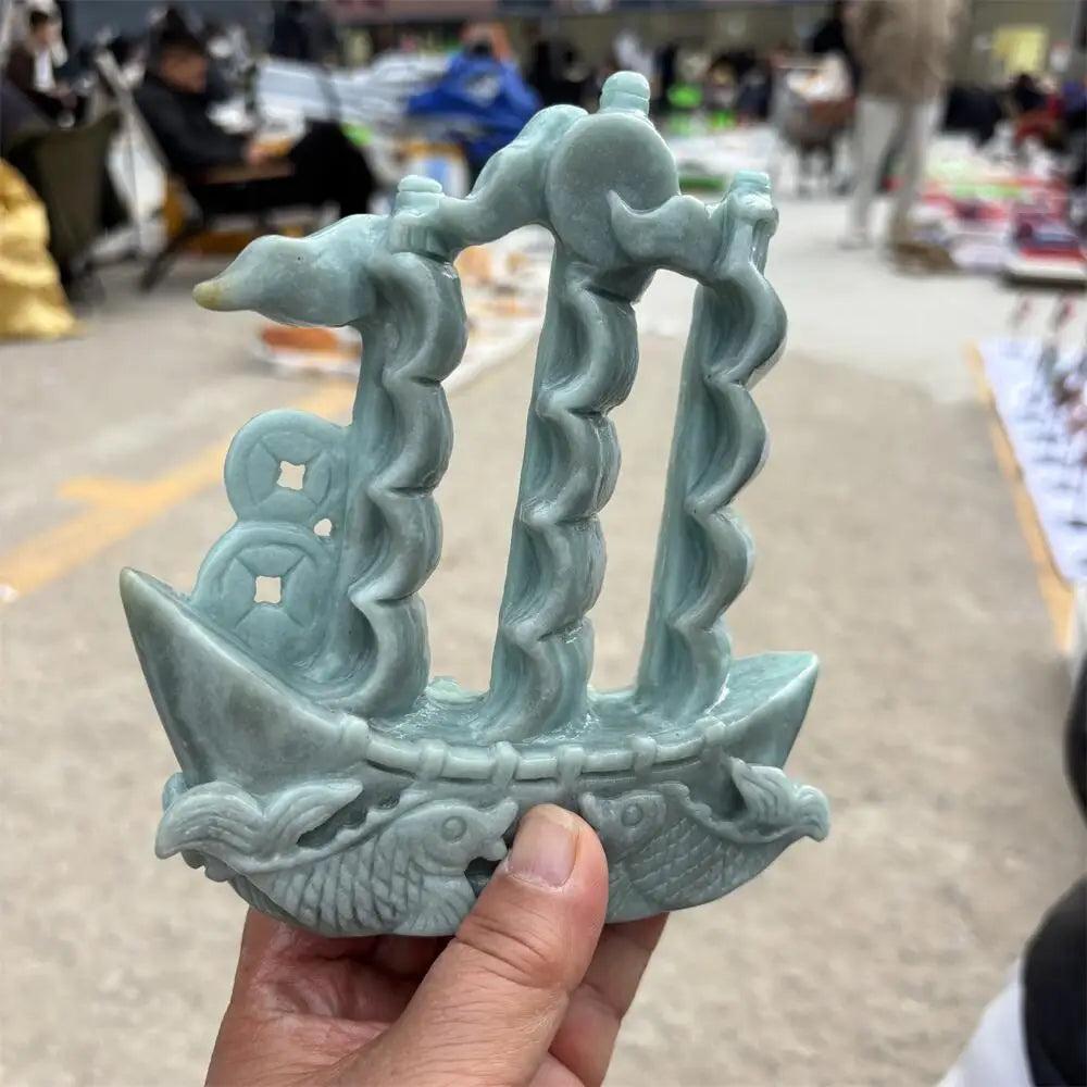 Hand-carved green jade sailboat statue for prosperity, featuring intricate sails and fish motifs for heart chakra healing.
