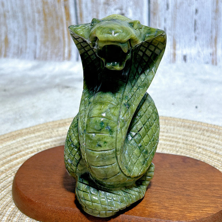 Green Jasper Crystal Carved Striking Cobra, a grounding, hand-carved serpent sculpture for heart and root chakra healing.