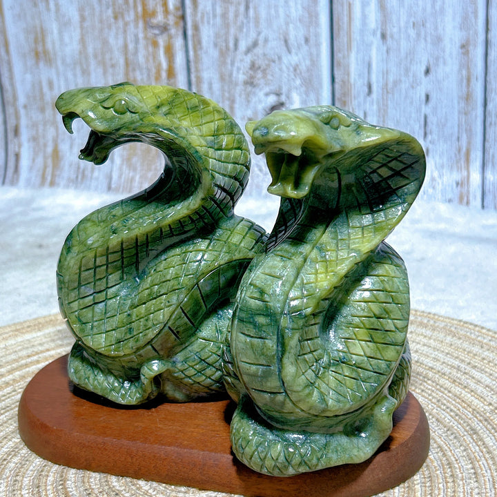 Green Jasper Crystal Carved Striking Cobra, a grounding, hand-carved serpent sculpture for heart and root chakra healing.