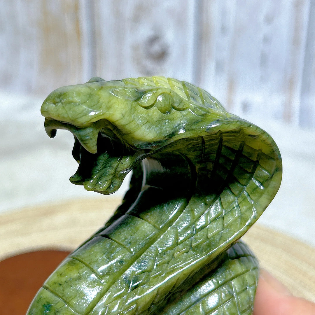 Green Jasper Crystal Carved Striking Cobra with detailed scales, perfect for grounding and Heart Chakra healing.