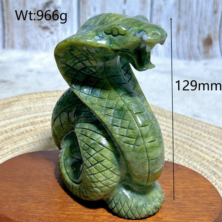 Green jasper crystal carved into a striking 129mm cobra, a grounding sculptural piece for heart and root chakra healing.