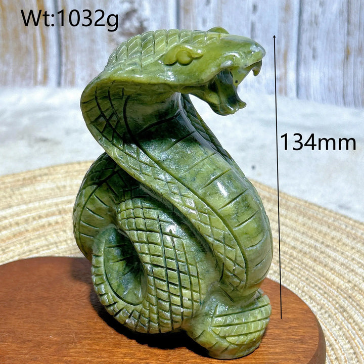 Green jasper crystal carved into a striking cobra, 134mm tall, grounding energy for heart and root chakra meditation.