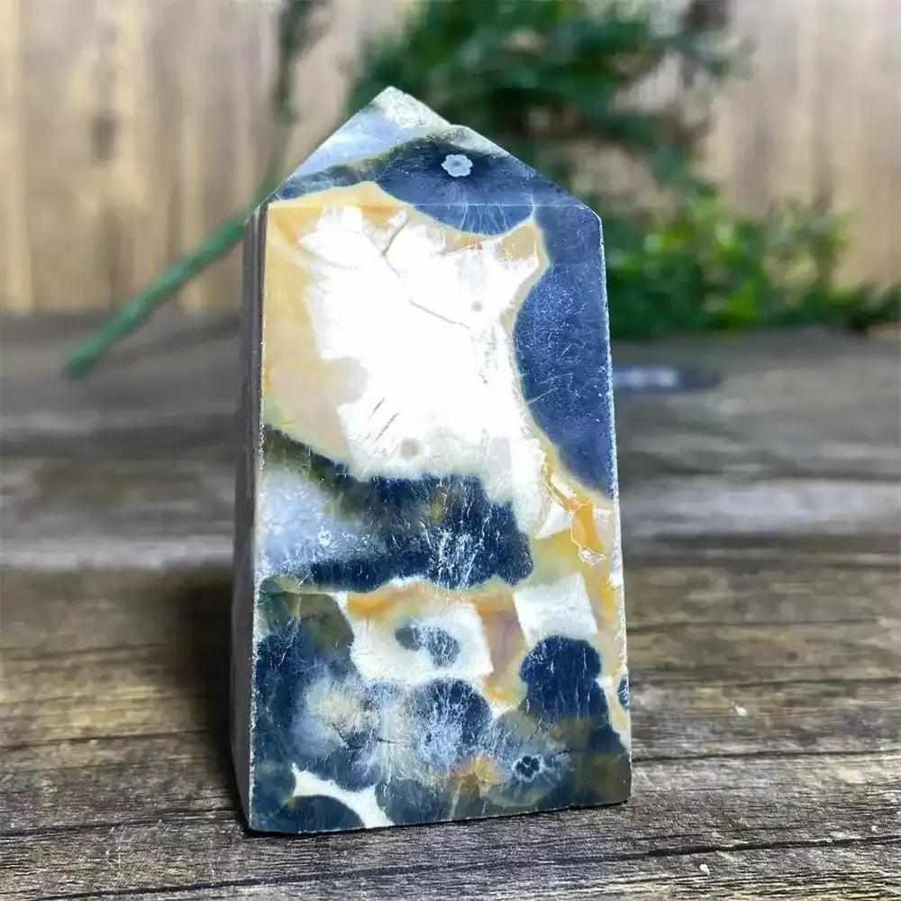 Polished Green Ocean Jasper tower featuring calming green tones and creamy orb patterns for Heart Chakra healing.