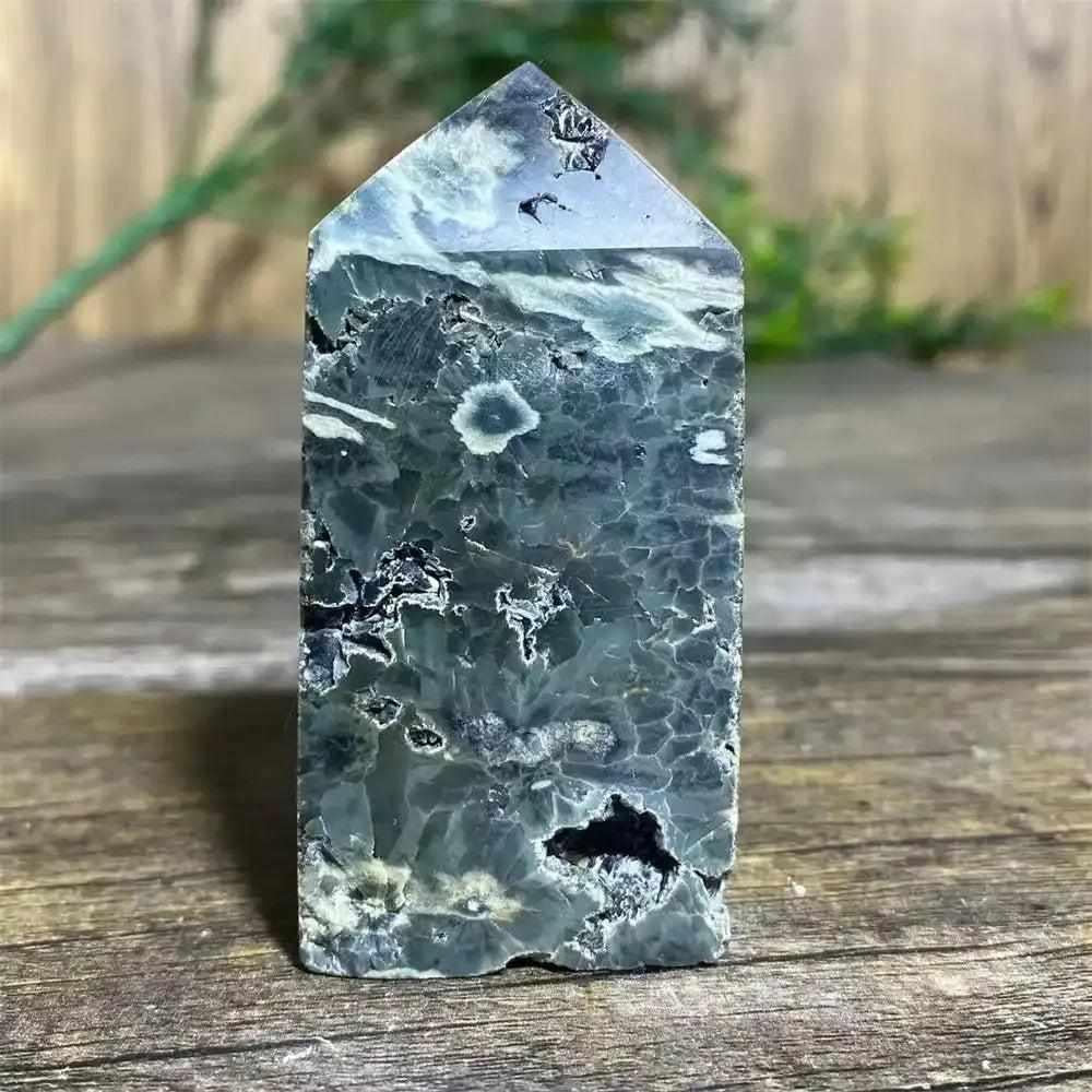 Polished Green Ocean Jasper tower featuring calming green tones, creamy orbs, and natural swirls for heart chakra healing.