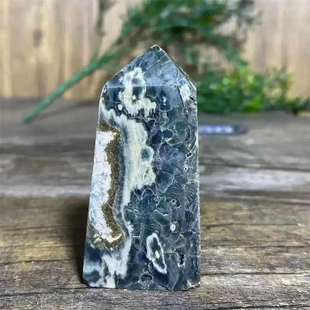 Polished Green Ocean Jasper tower featuring calming green tones, creamy orbs, and swirls for Heart Chakra healing.