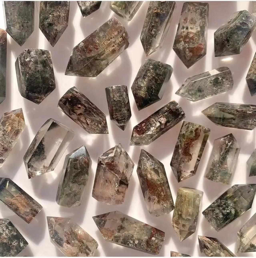 Green Phantom Garden Quartz points featuring mossy inclusions and clear crystal towers for heart chakra healing.