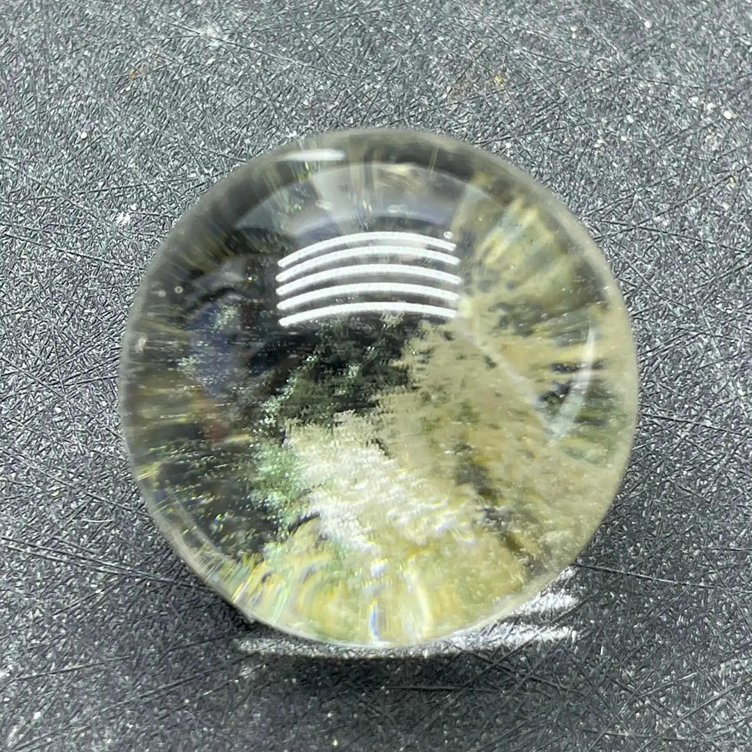 Polished Green Phantom Garden Quartz sphere featuring mossy green inclusions and clear crystal for heart chakra healing.