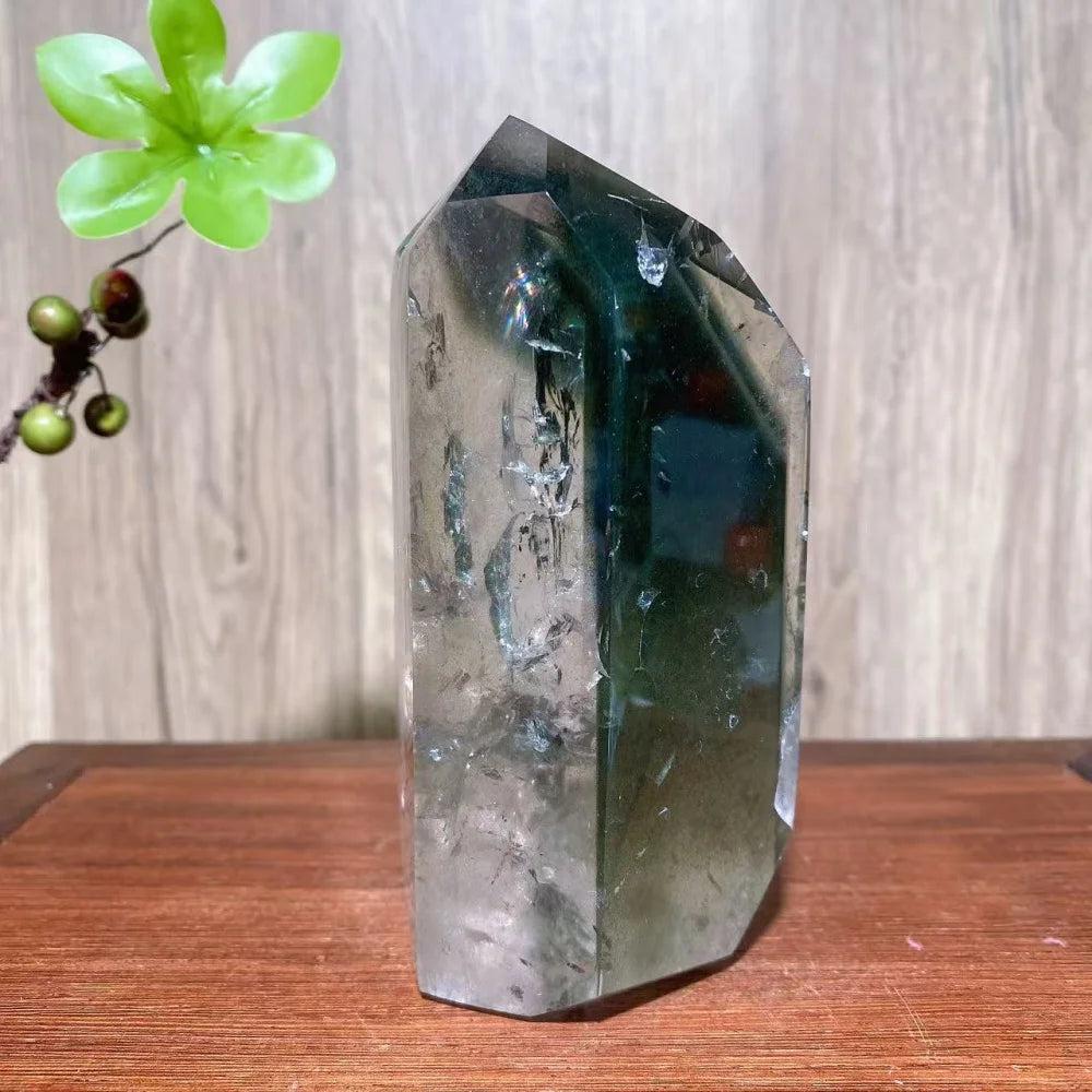 Green Phantom Quartz Crystal Double Terminated Tower: Clear crystal with vibrant green chlorite inclusions, promoting growth and transformation.