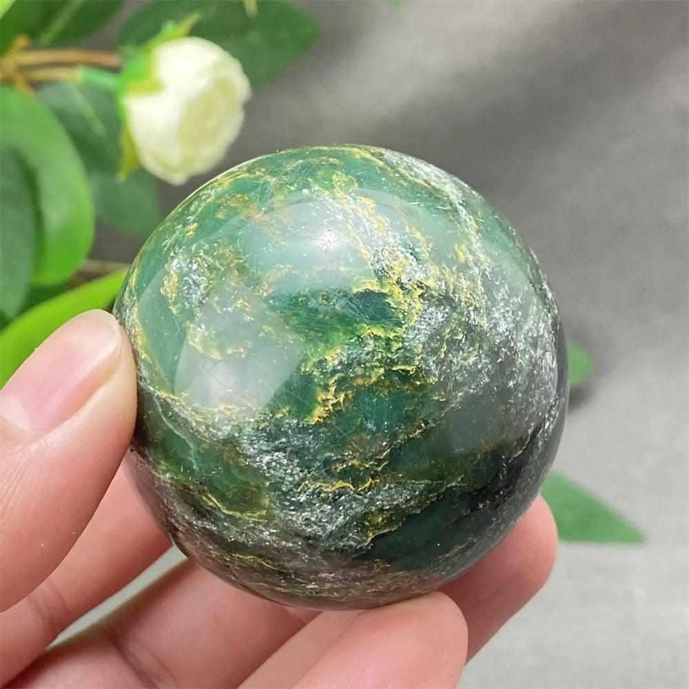 Polished Green Verdite sphere with rich deep green tones and natural patterns, perfect for grounding and heart chakra healing.