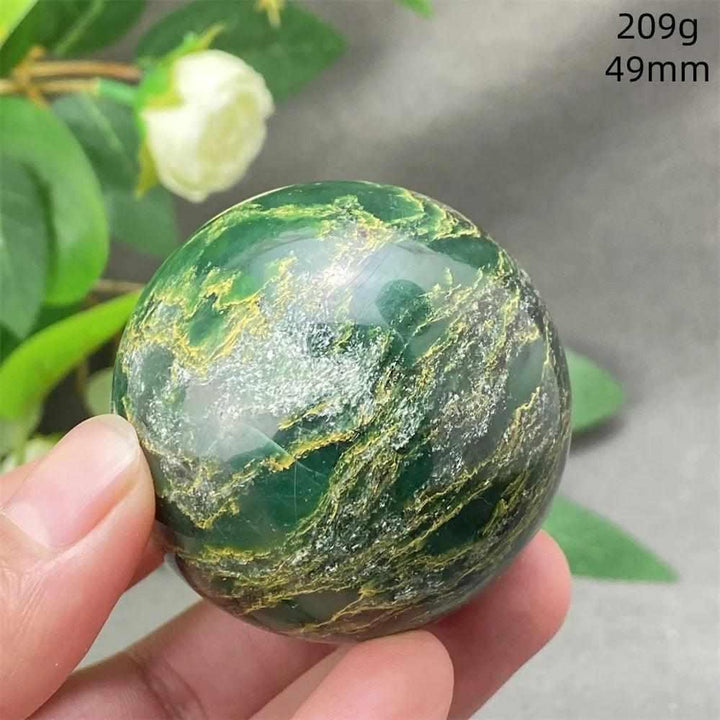 Polished 49mm Green Verdite sphere with rich, deep green tones and grounding energy for heart and root chakra healing.
