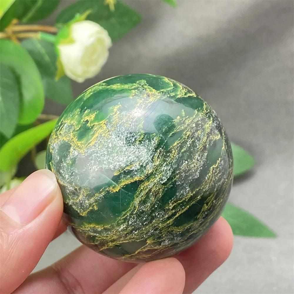 Polished Green Verdite sphere featuring deep green tones and natural veining, perfect for heart chakra grounding.