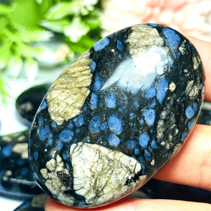 Quesera Palm-Crystal stone with vibrant blue spots and beige patterns, perfect for healing.