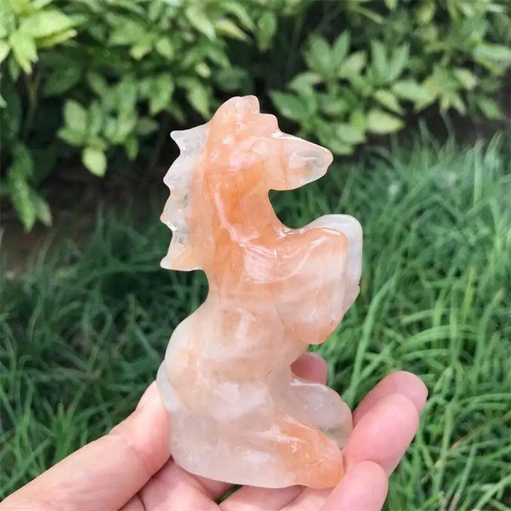 Hand-carved Hematoid Fire Quartz horse sculpture with fiery red and orange hematite inclusions for grounding energy.