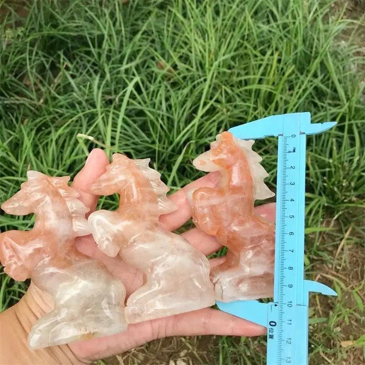 Hand-carved Hematoid Fire Quartz horse sculptures featuring fiery red and orange hematite inclusions for grounded energy.