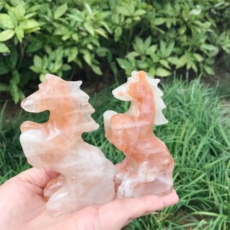 Hand-carved Hematoid Fire Quartz horse sculptures with fiery red and orange hematite inclusions for grounding energy.