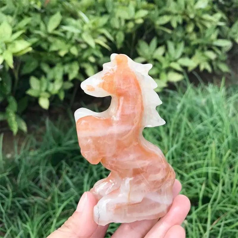 Hand-carved Hematoid Fire Quartz horse sculpture featuring fiery red and orange hematite inclusions for grounded energy.