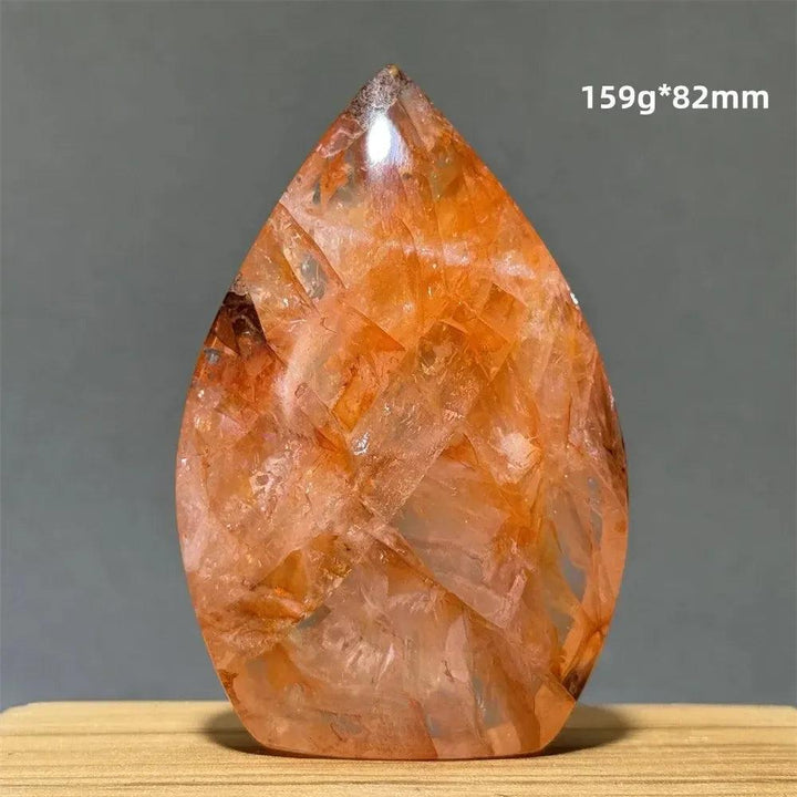 Hematoid Fire Quartz freeform torch from Crystal Destiny, showcasing vibrant red-orange inclusions and a polished finish.