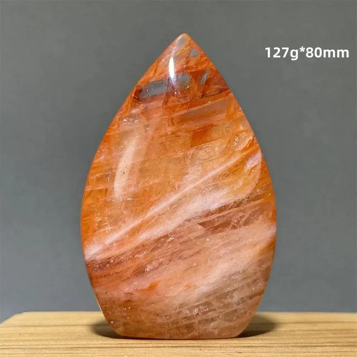 Hematoid Fire Quartz freeform torch from Crystal Destiny, showcasing fiery red, orange, and gold inclusions.