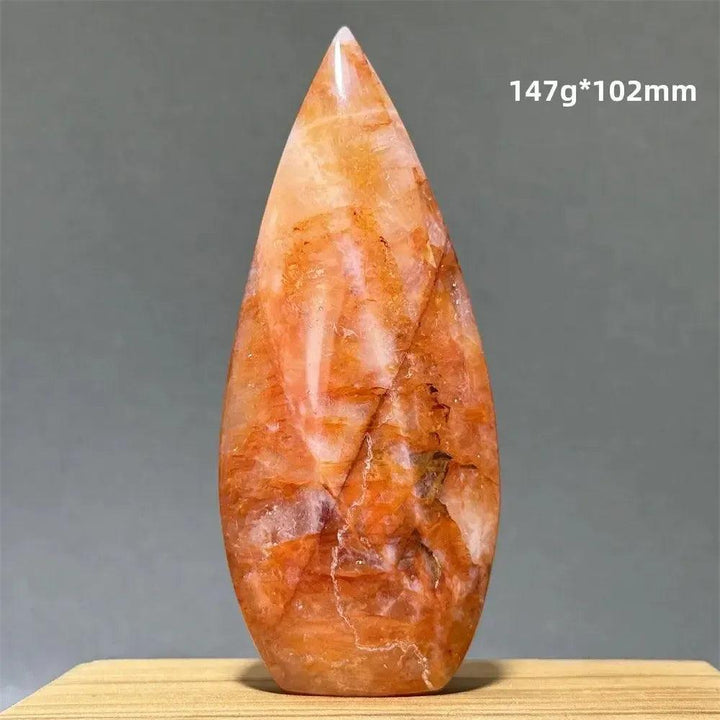 Hematoid Fire Quartz freeform torch from Crystal Destiny, showcasing fiery red, orange, and gold inclusions.