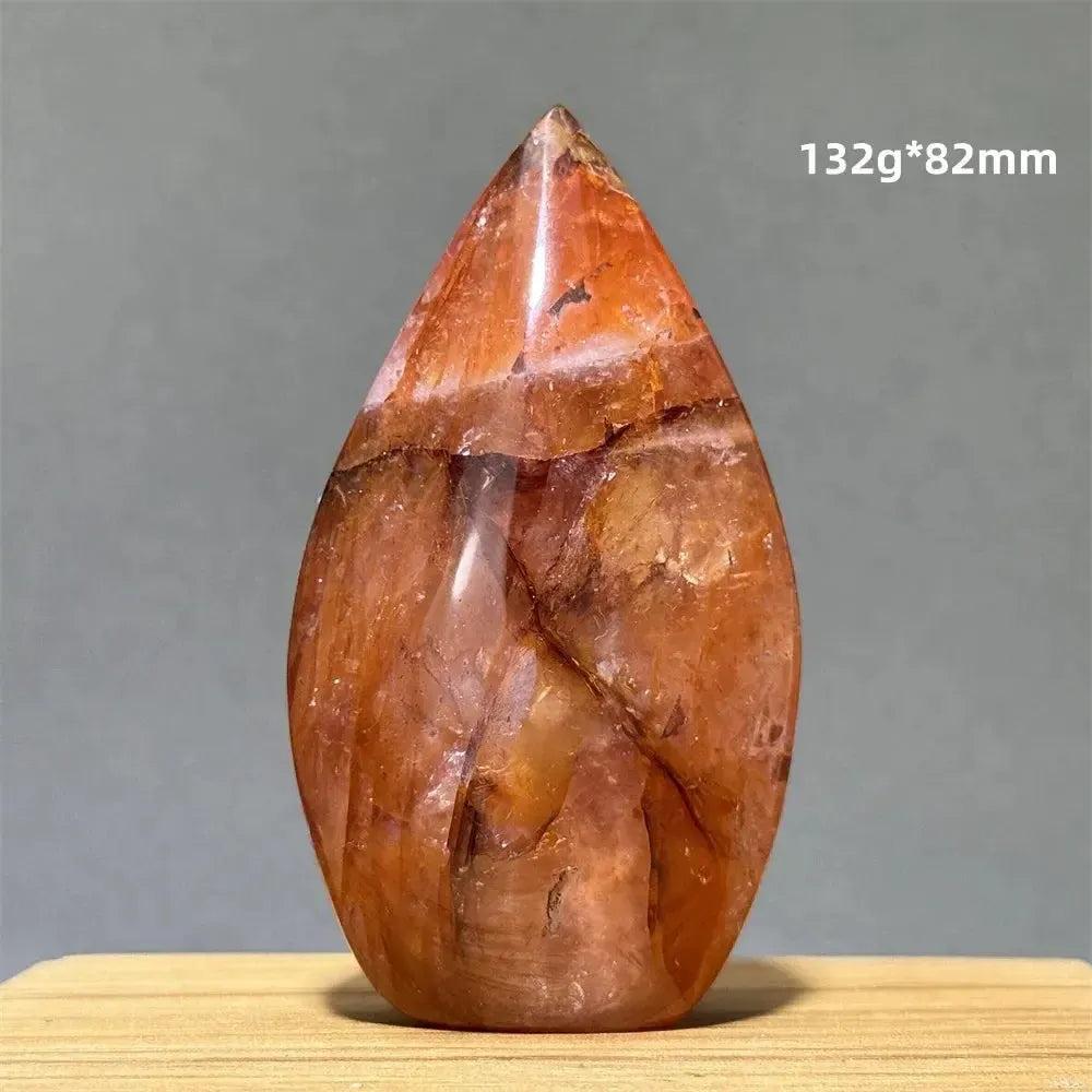 Hematoid Fire Quartz freeform torch from Crystal Destiny, displaying vibrant red, orange, and gold mineral inclusions.