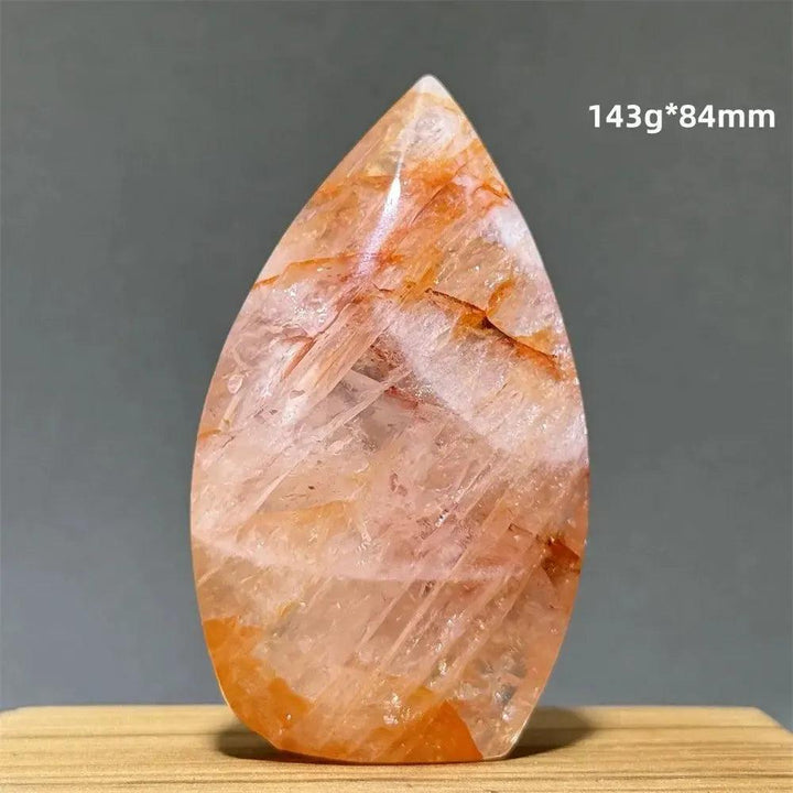 Hematoid Fire Quartz freeform torch from Crystal Destiny, showcasing vibrant red and orange iron oxide inclusions.