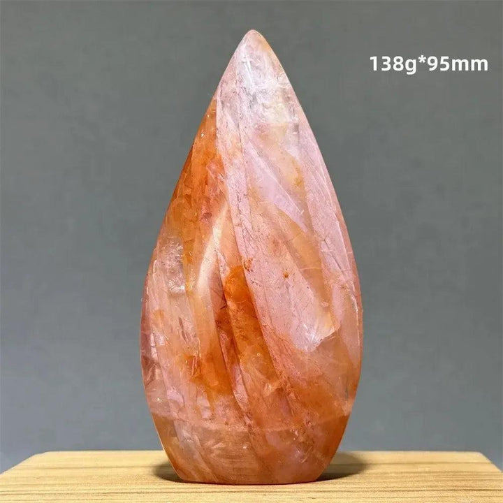 Hematoid Fire Quartz freeform torch from Crystal Destiny, showing fiery red, orange, and gold inclusions.