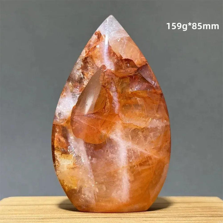 Hematoid Fire Quartz freeform torch from Crystal Destiny, showcasing vibrant red, orange, and gold inclusions.