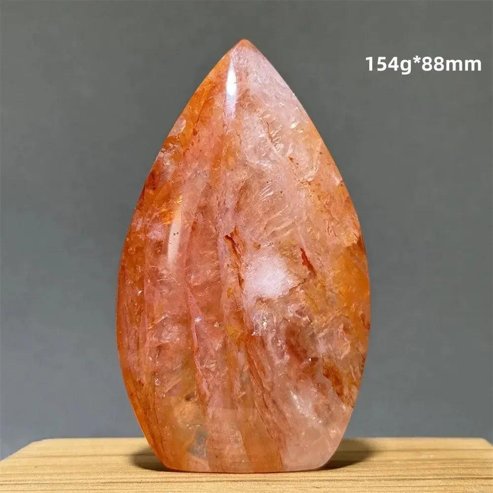 Hematoid Fire Quartz freeform torch from Crystal Destiny, showing red, orange, and gold mineral inclusions.