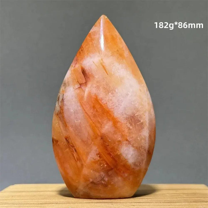 Hematoid Fire Quartz freeform torch from Crystal Destiny, showcasing fiery red, orange, and gold inclusions.
