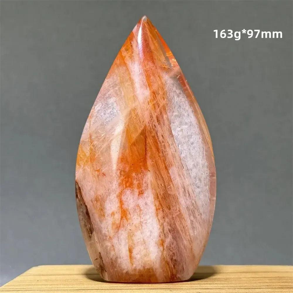 Hematoid Fire Quartz freeform torch from Crystal Destiny, showcasing vibrant red, orange, and gold mineral inclusions.