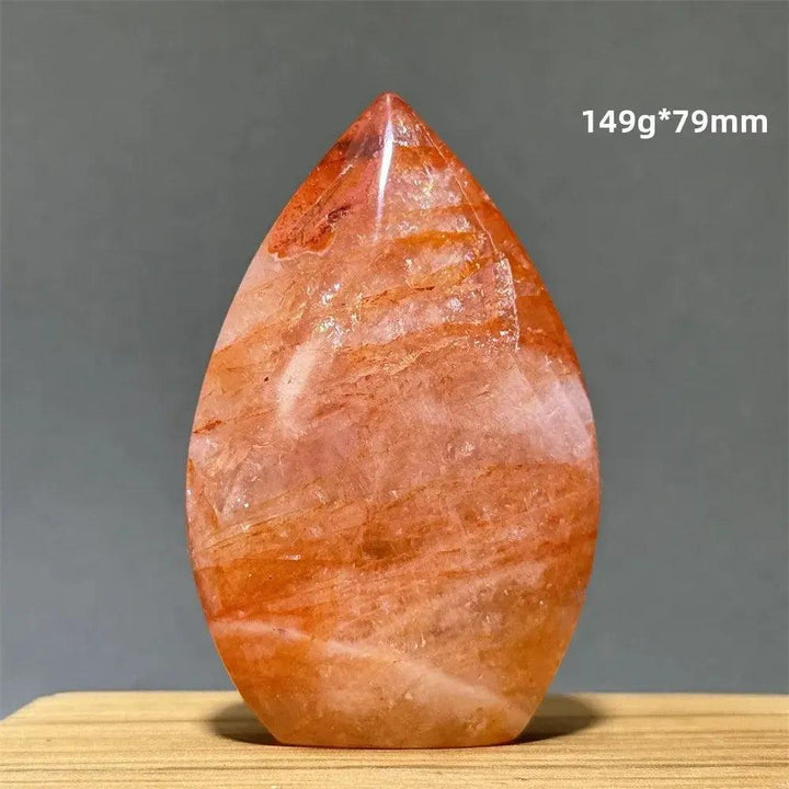 Hematoid Fire Quartz freeform torch from Crystal Destiny, showcasing fiery red, orange, and gold mineral inclusions.