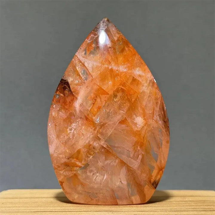 Vibrant orange and red Hematoid Fire Quartz freeform torch from Crystal Destiny, showcasing fiery inclusions.