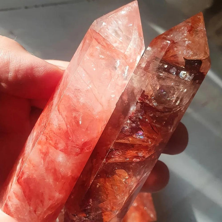 Two fiery Hematoid Quartz Crystal Towers, showcasing red and orange Hematite inclusions for grounding and energizing.