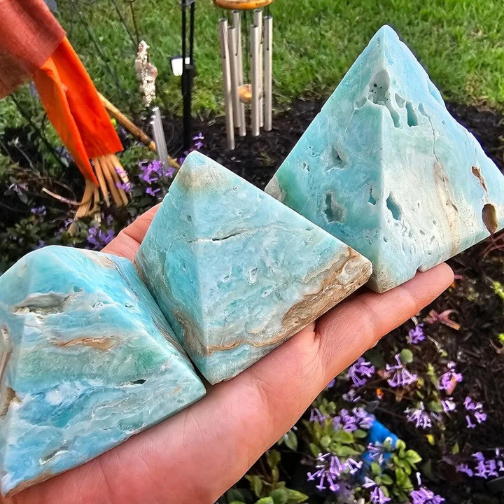 Three sky blue Hemimorphite Crystal Pyramids with natural textures for throat chakra healing.