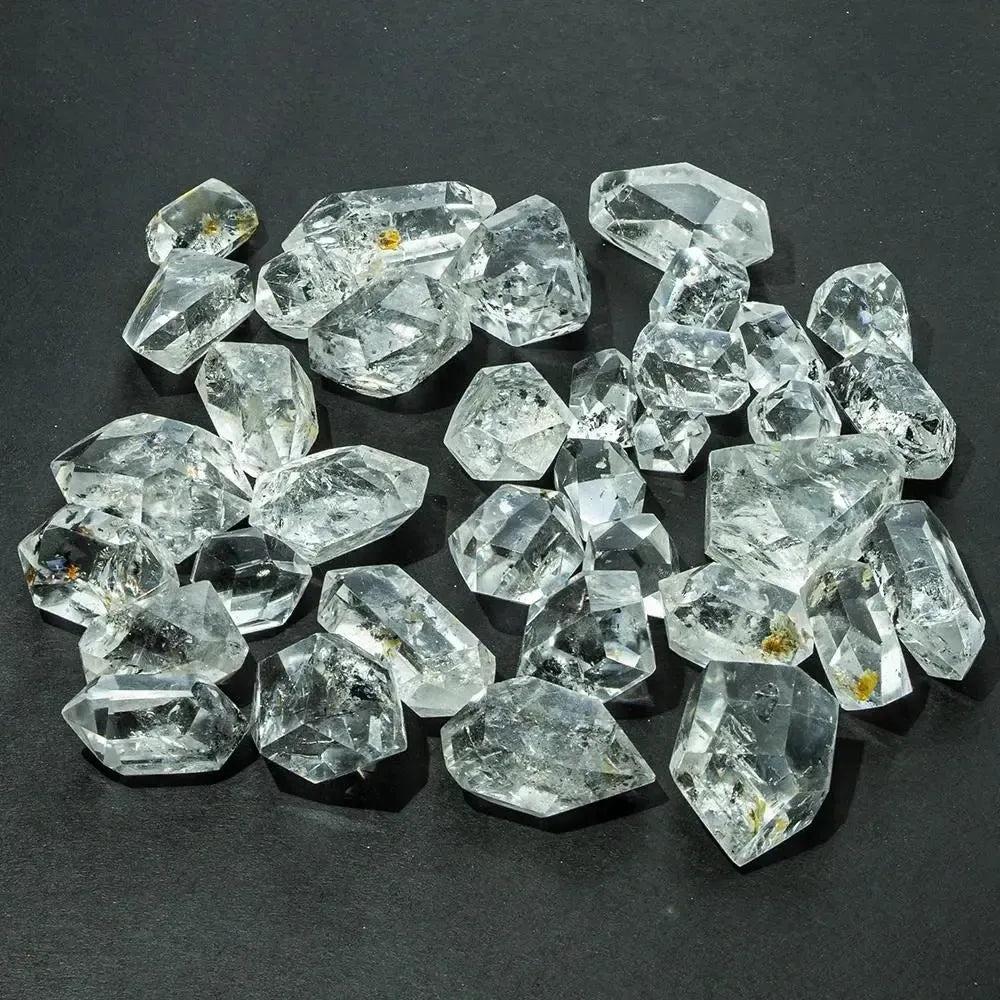 Clear, naturally faceted Herkimer Diamond quartz crystals from Crystal Destiny, showcasing double-terminated points.