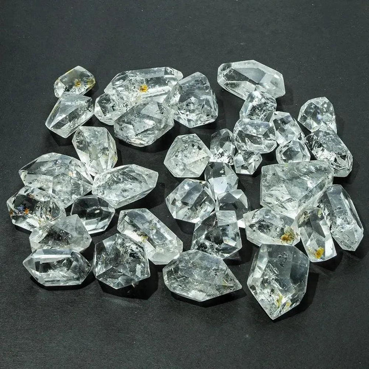 Clear, naturally faceted Herkimer Diamond quartz crystals from Crystal Destiny, showcasing double-terminated points.
