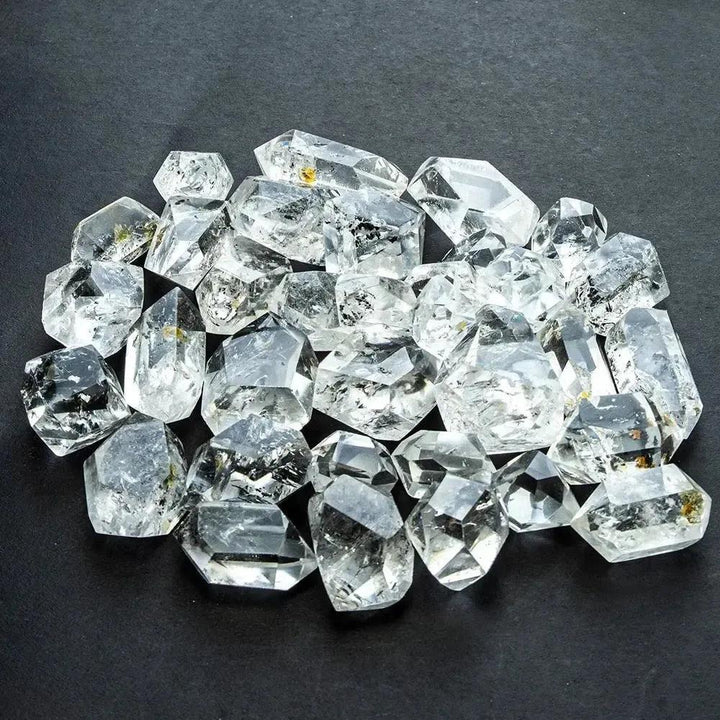 Clear, raw Herkimer Diamond quartz crystals from Crystal Destiny, showcasing double-terminated points and natural facets.