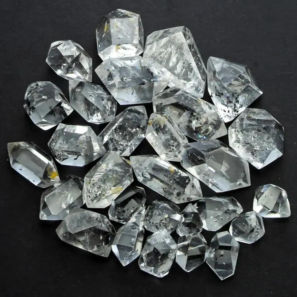 Clear, raw Herkimer Diamond quartz crystals from Crystal Destiny, showcasing double-terminated points and natural facets.