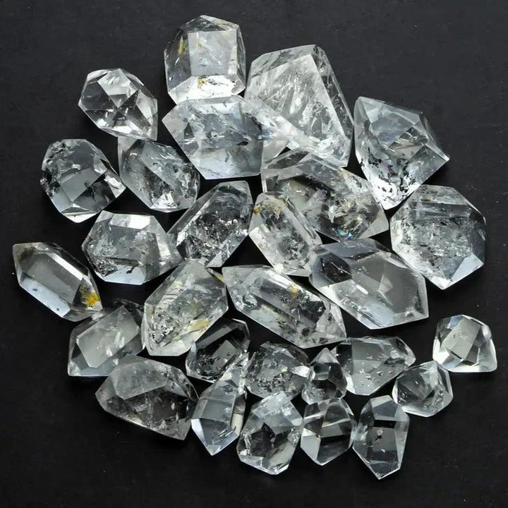 Clear, raw Herkimer Diamond quartz crystals from Crystal Destiny, showcasing double-terminated points and natural facets.