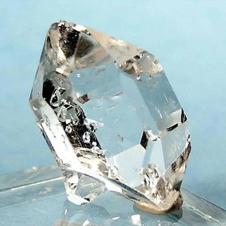 Clear, double-terminated Herkimer Diamond quartz crystal from Crystal Destiny, showcasing brilliant clarity and natural facets.