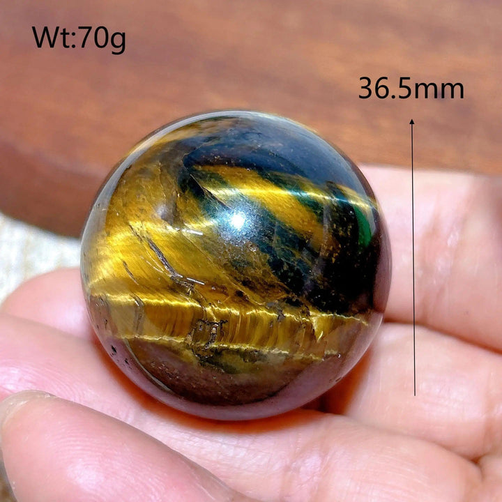 Flashy 36.5mm blue and yellow tiger eye crystal sphere, a polished natural stone ball perfect for healing and home decor.