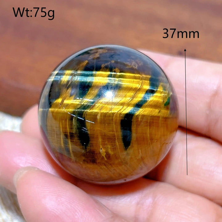 37mm Blue and Yellow Tiger Eye crystal sphere, a flashy polished healing stone ball perfect for Feng Shui home decor.