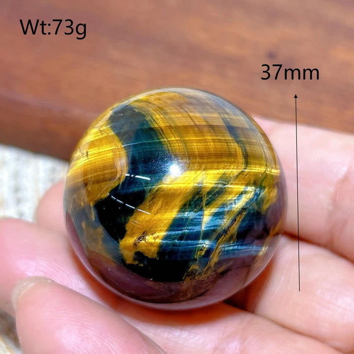 Polished 37mm blue and yellow Tiger Eye crystal sphere, a flashy healing stone ornament for energy and home decor.