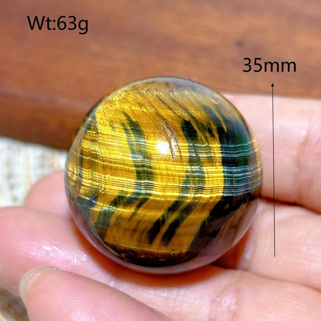35mm Blue and Yellow Tiger Eye crystal sphere, a flashy polished healing stone ball perfect for Feng Shui home decor.